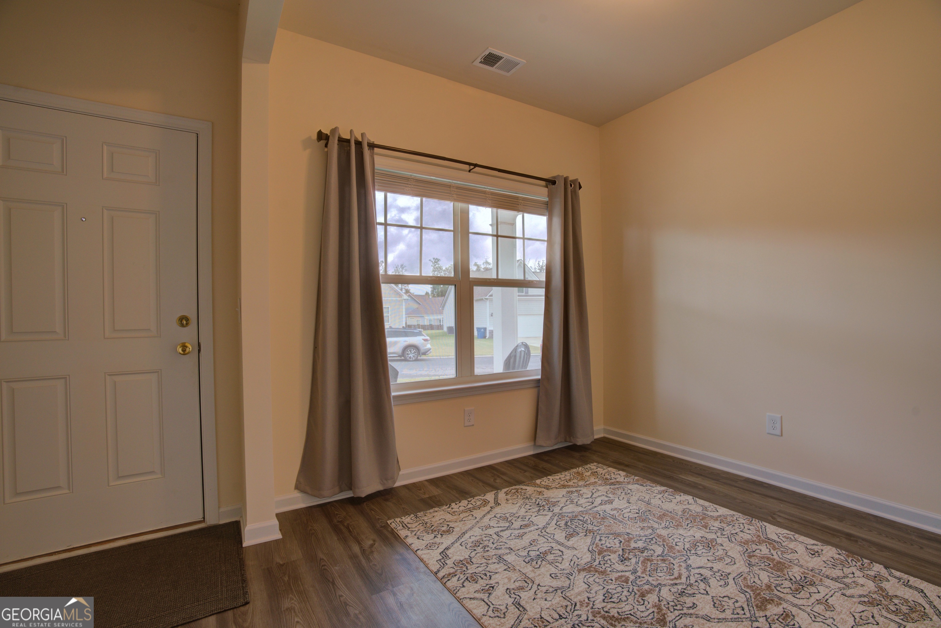 12 Applewood Drive Northeast Rome, GA 30165 - Photo 12 of 31 an empty room with wooden floor and windows