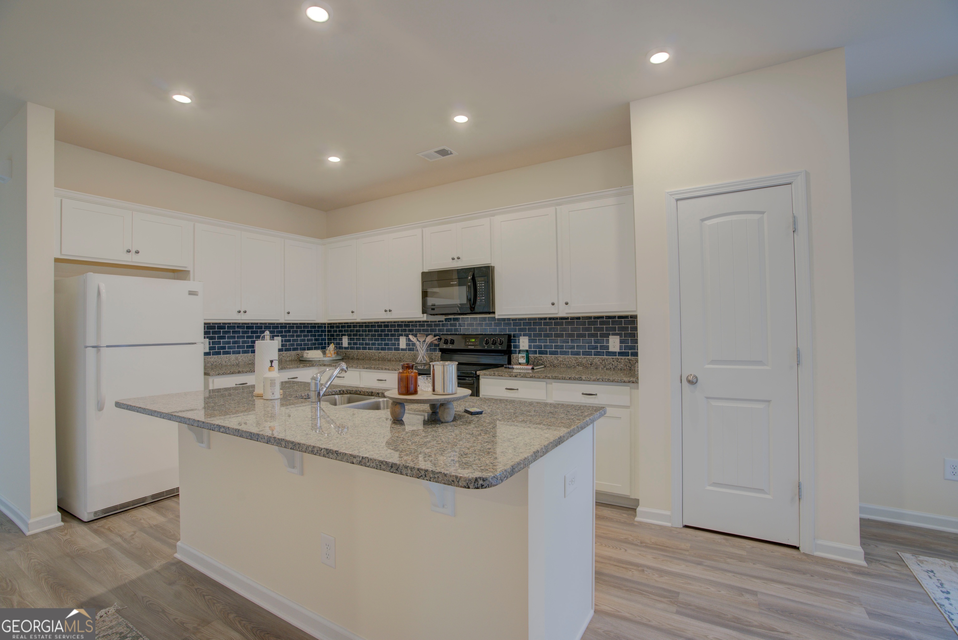 12 Applewood Drive Northeast Rome, GA 30165 - Photo 14 of 31 a kitchen with stainless steel appliances granite countertop a sink a stove and a refrigerator