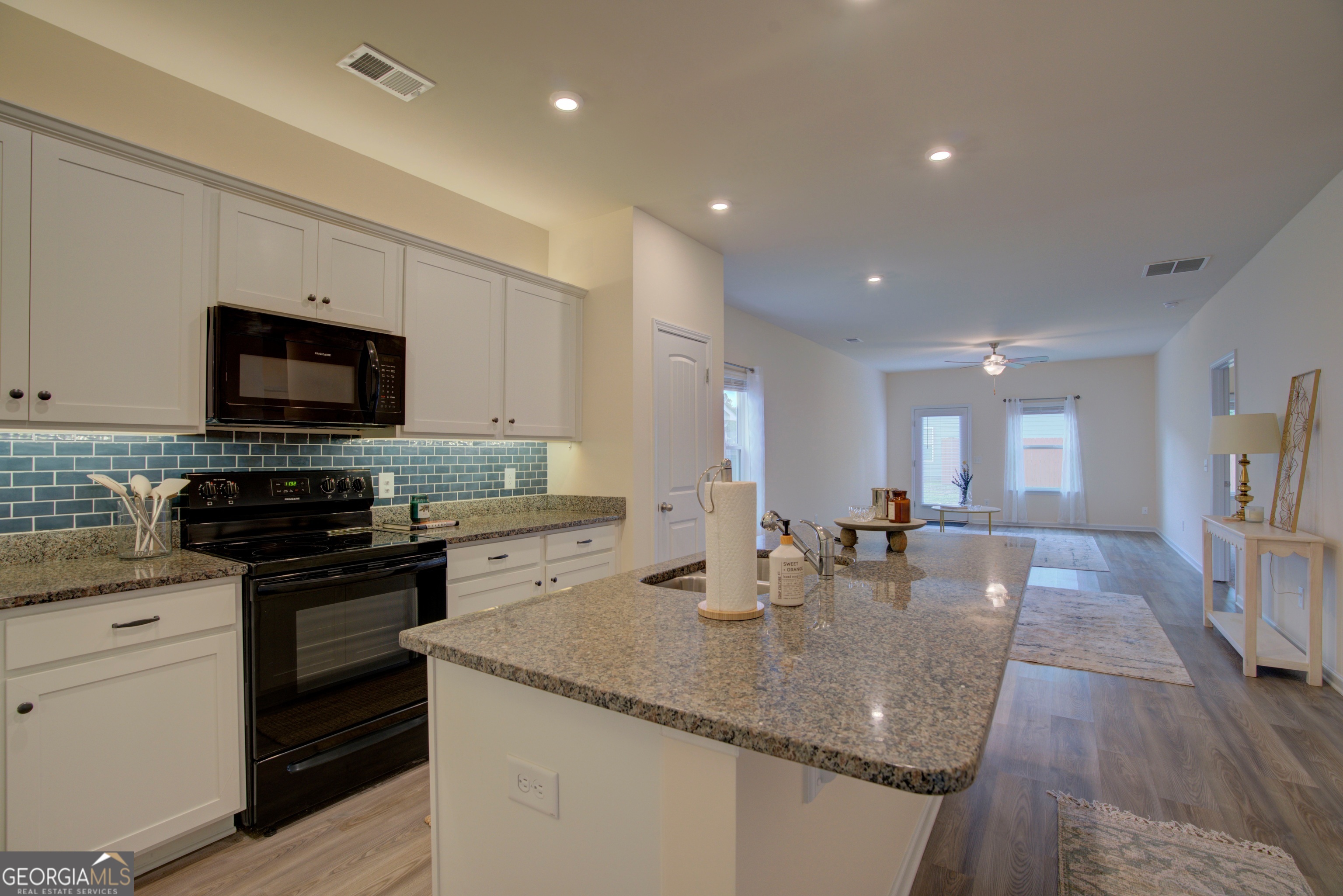12 Applewood Drive Northeast Rome, GA 30165 - Photo 17 of 31 a kitchen with stainless steel appliances granite countertop a sink stove and microwave