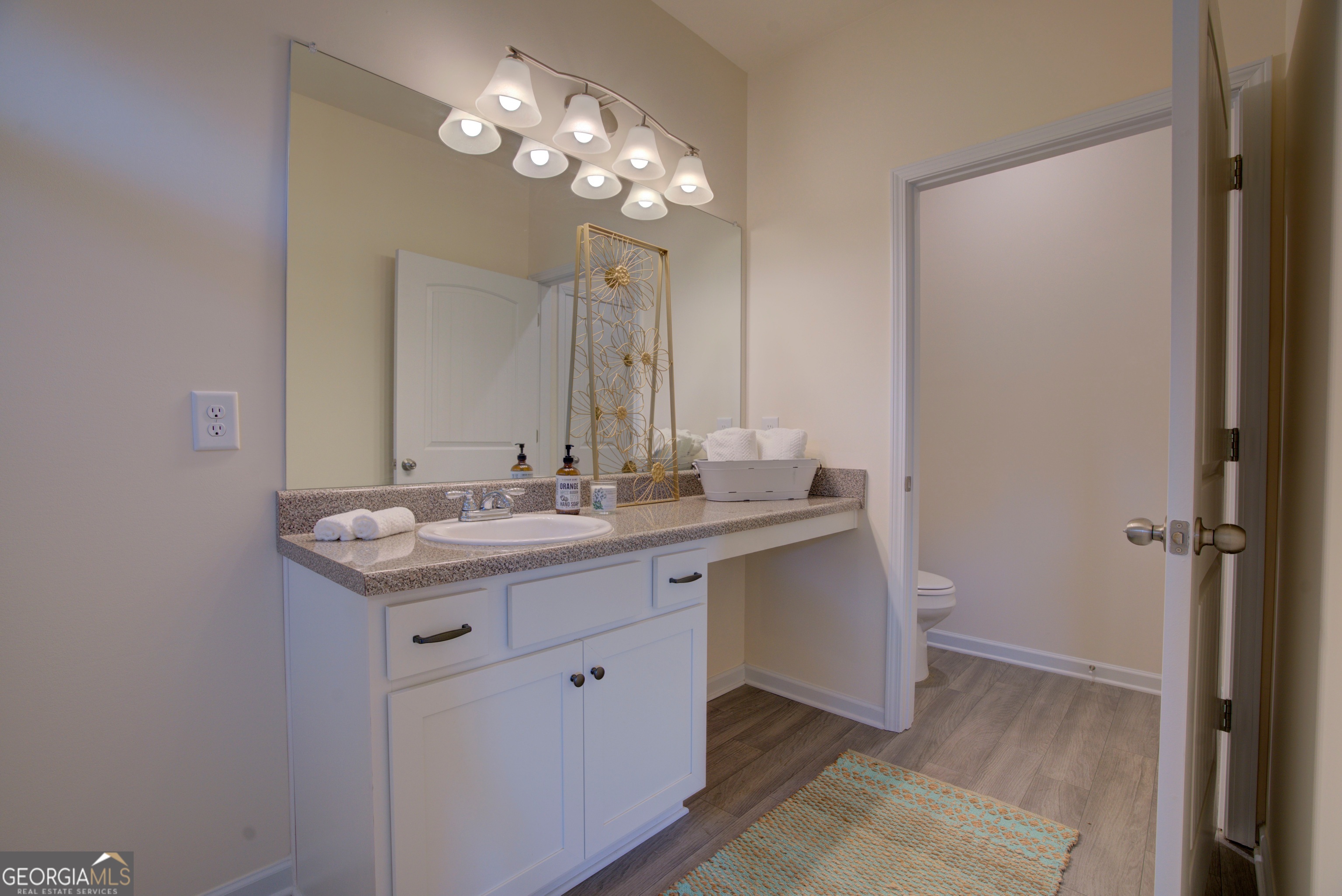 12 Applewood Drive Northeast Rome, GA 30165 - Photo 23 of 31 a bathroom with a sink and a mirror