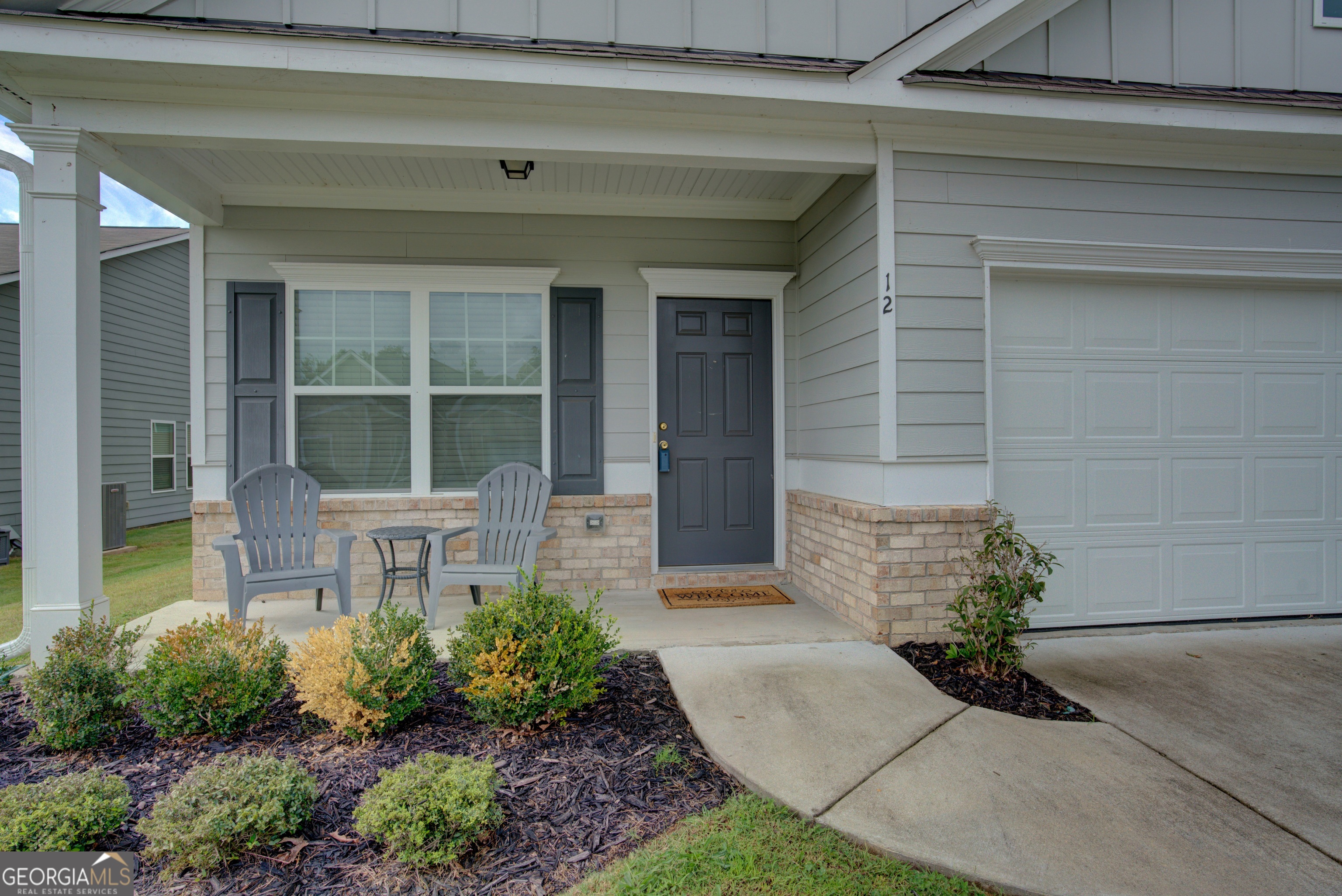 12 Applewood Drive Northeast Rome, GA 30165 - Photo 3 of 31 a house with potted plants in front of door