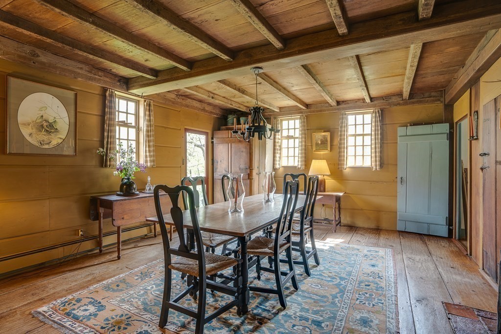 83 Whitney Road Harvard, MA 01451 - Photo 14 of 41 a view of a dining room with furniture window and wooden floor