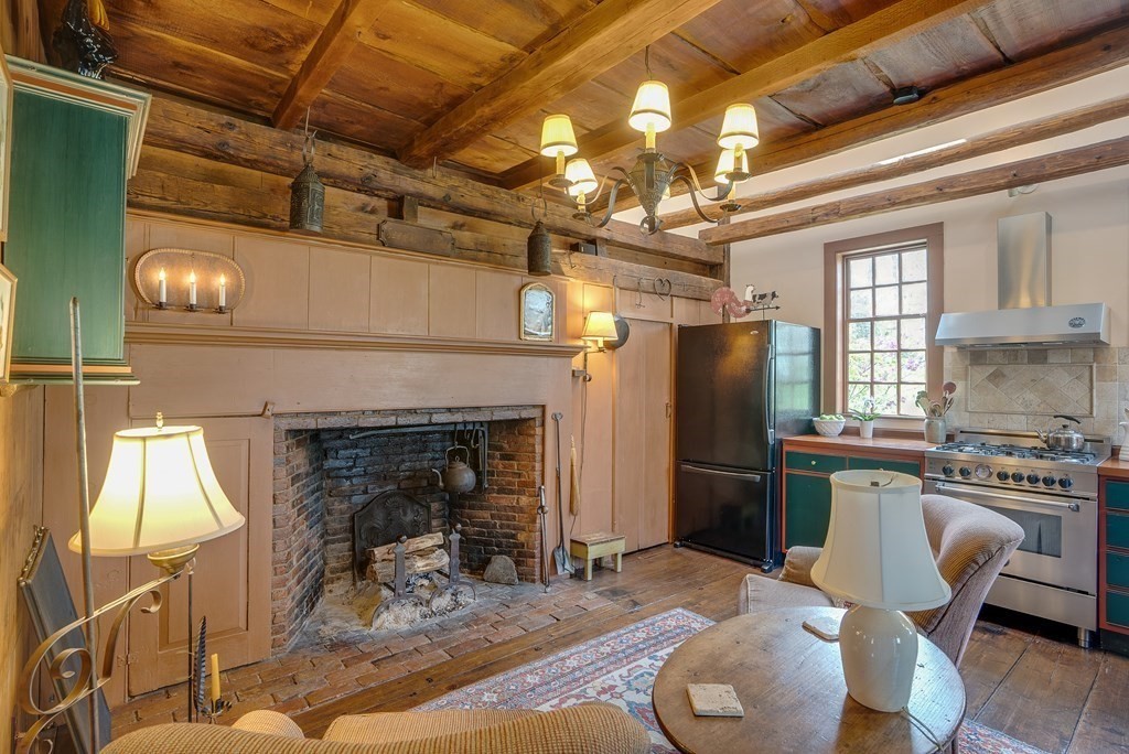 83 Whitney Road Harvard, MA 01451 - Photo 24 of 41 a kitchen with furniture and a fireplace