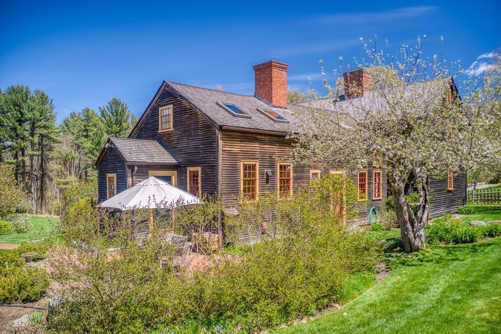 83 Whitney Road Harvard, MA 01451 - Photo 3 of 41 a front view of house with yard and trees