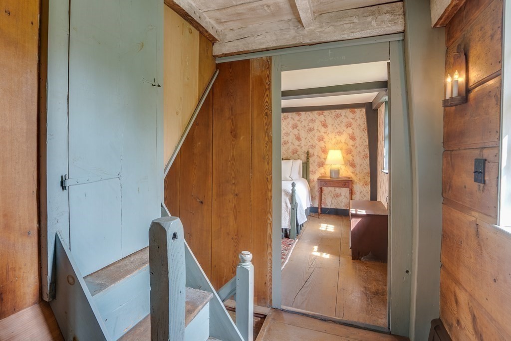 83 Whitney Road Harvard, MA 01451 - Photo 31 of 41 a view of a hallway with furniture and floor to ceiling window