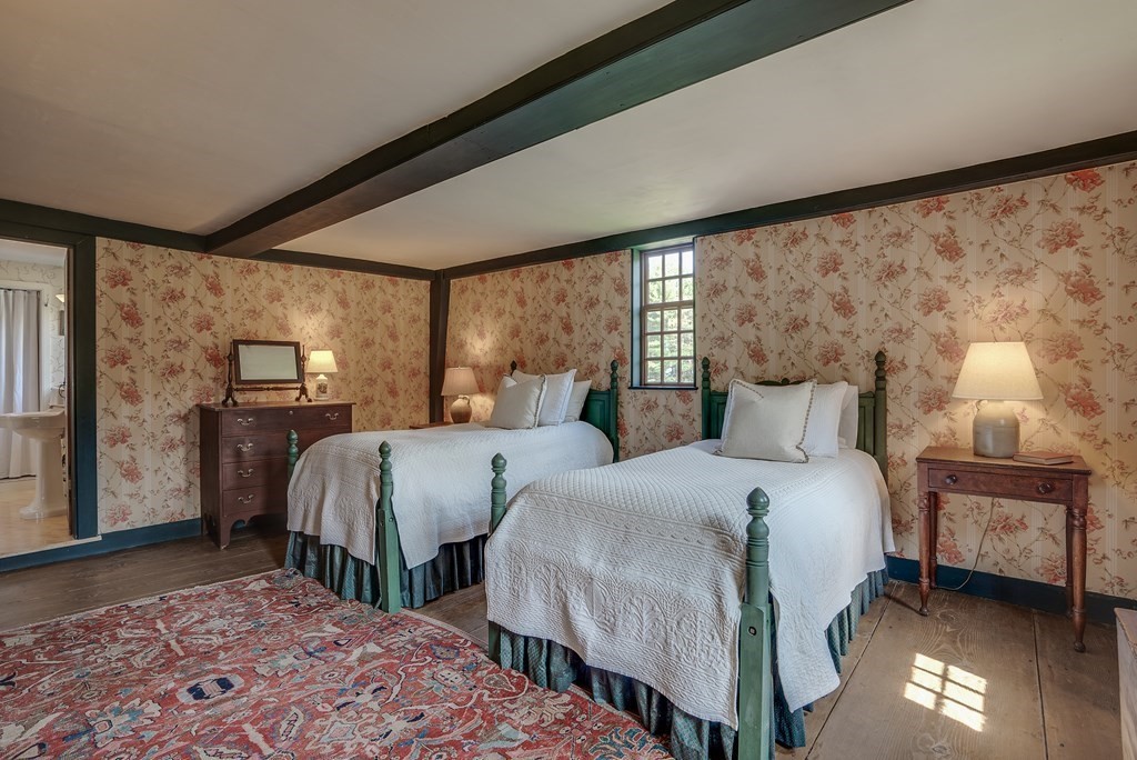 83 Whitney Road Harvard, MA 01451 - Photo 32 of 41 a bedroom with two beds and a lamp
