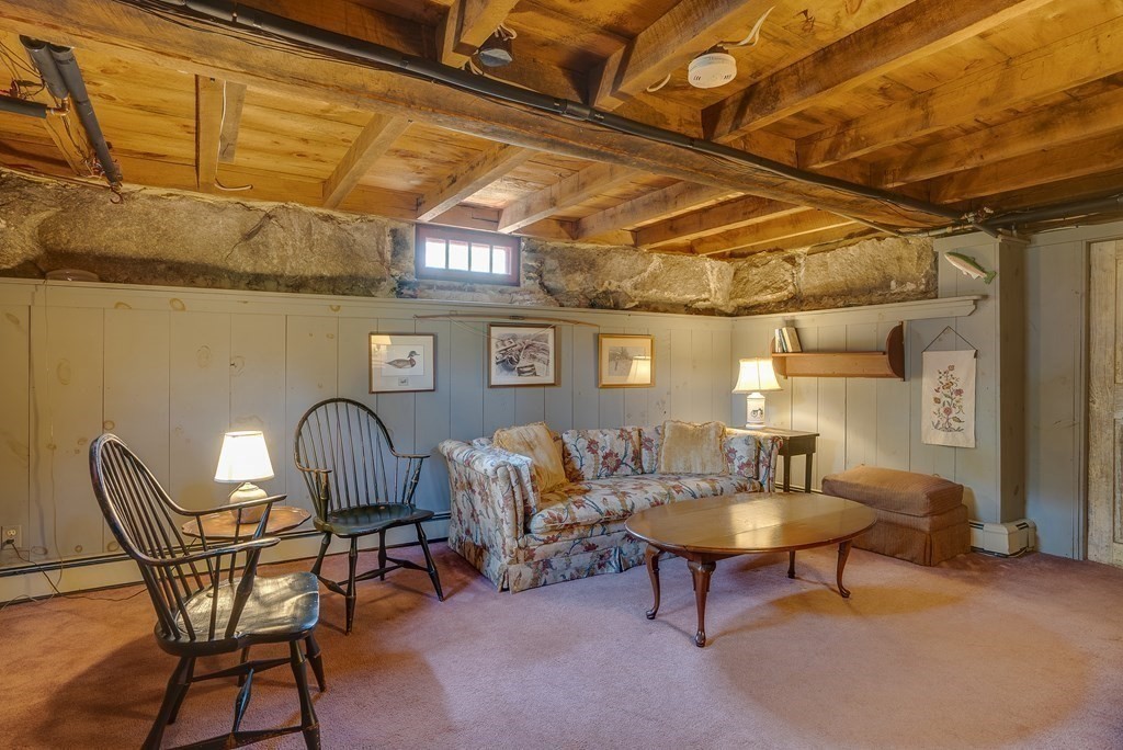 83 Whitney Road Harvard, MA 01451 - Photo 40 of 41 a living room with furniture and a chandelier