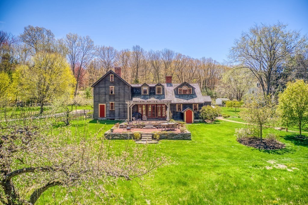 83 Whitney Road Harvard, MA 01451 - Photo 5 of 41 a front view of a house with garden
