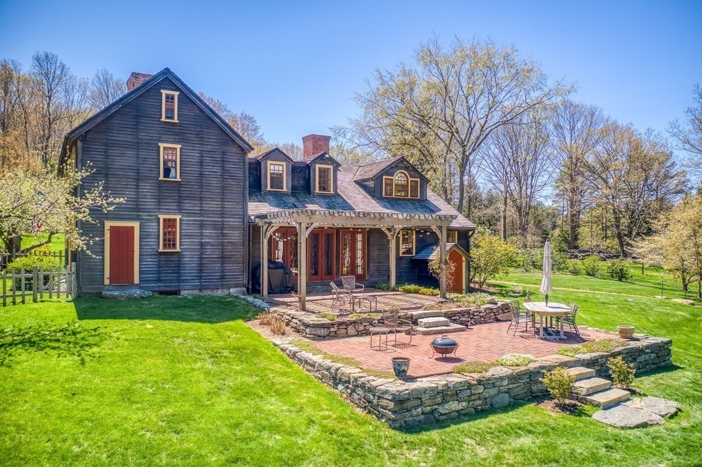 83 Whitney Road Harvard, MA 01451 - Photo 6 of 41 a front view of a house with garden