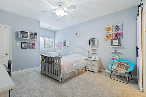 a bedroom with furniture and a window