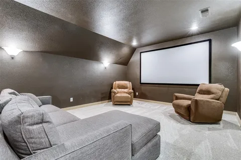 a bedroom with furniture and a projector