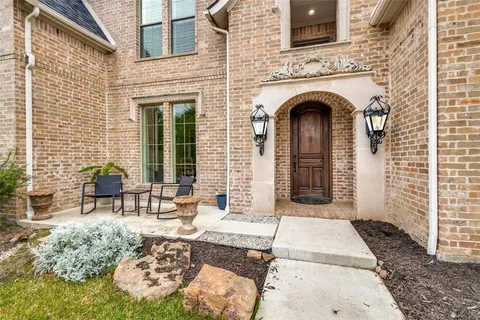 a front view of a house with outdoor seating