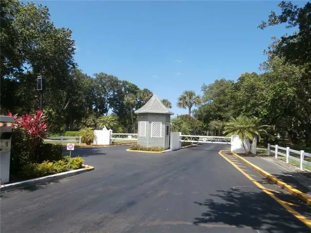 a view of a street with houses on both side