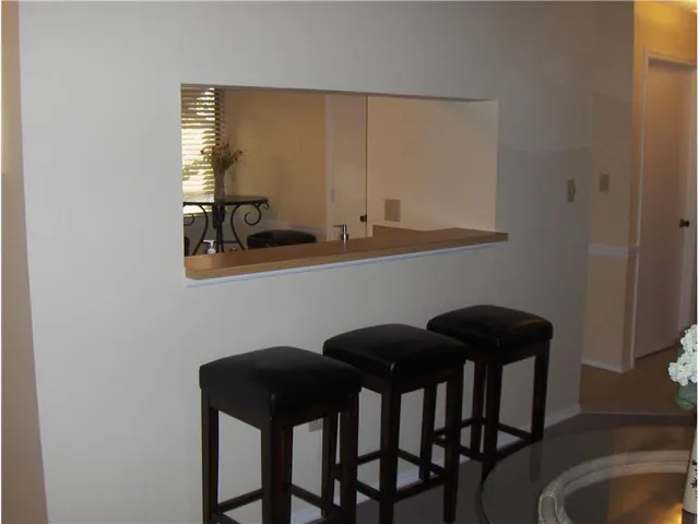 a view of a dining room with furniture and window