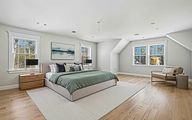 a view of hallway with wooden floor