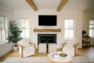 a living room with furniture fireplace and flat screen tv