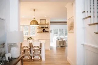 a view of living room with furniture and wooden floor