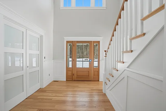 a view of a workspace with furniture and a bookshelf