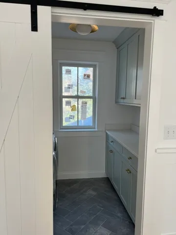 a bathroom with a sink and a window