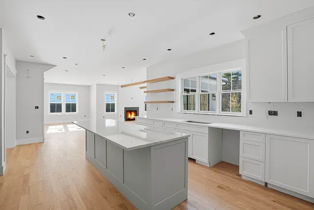 a kitchen with stainless steel appliances granite countertop a sink and a stove