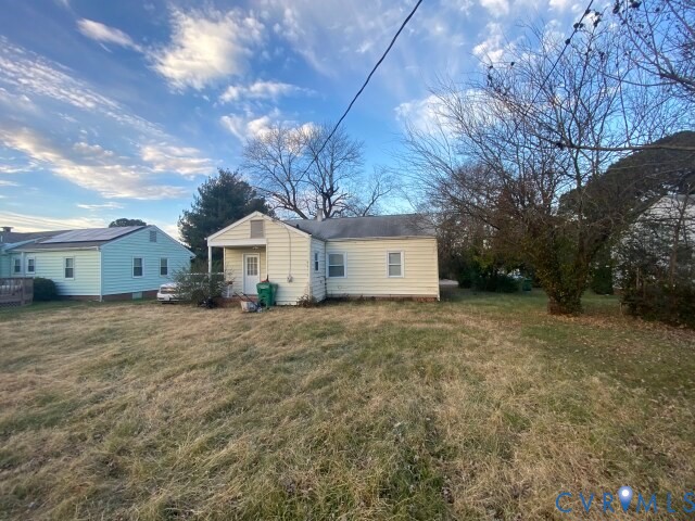 3603 Reynolds Road Richmond, VA 23223 - Photo 3 of 25 Back of house with a lawn