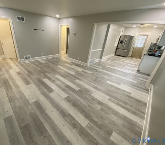 3603 Reynolds Road Richmond, VA 23223 - Photo 5 of 25 Unfurnished living room featuring light wood-style