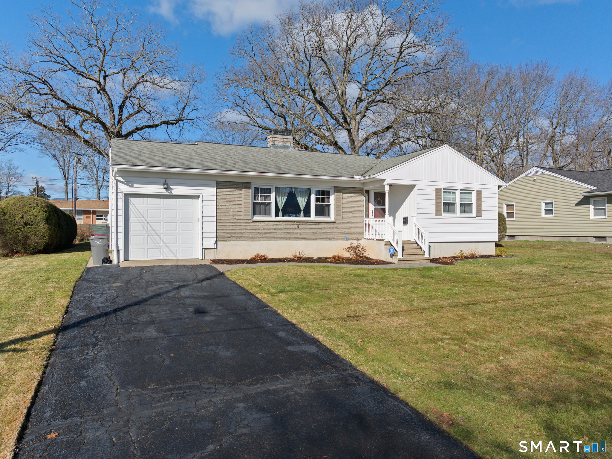 16 Phyllis Drive Naugatuck, CT 06770 - Photo 1 of 1 a front view of a house with garden