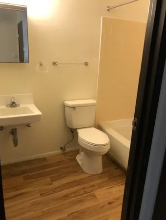 a bathroom with a toilet and a sink