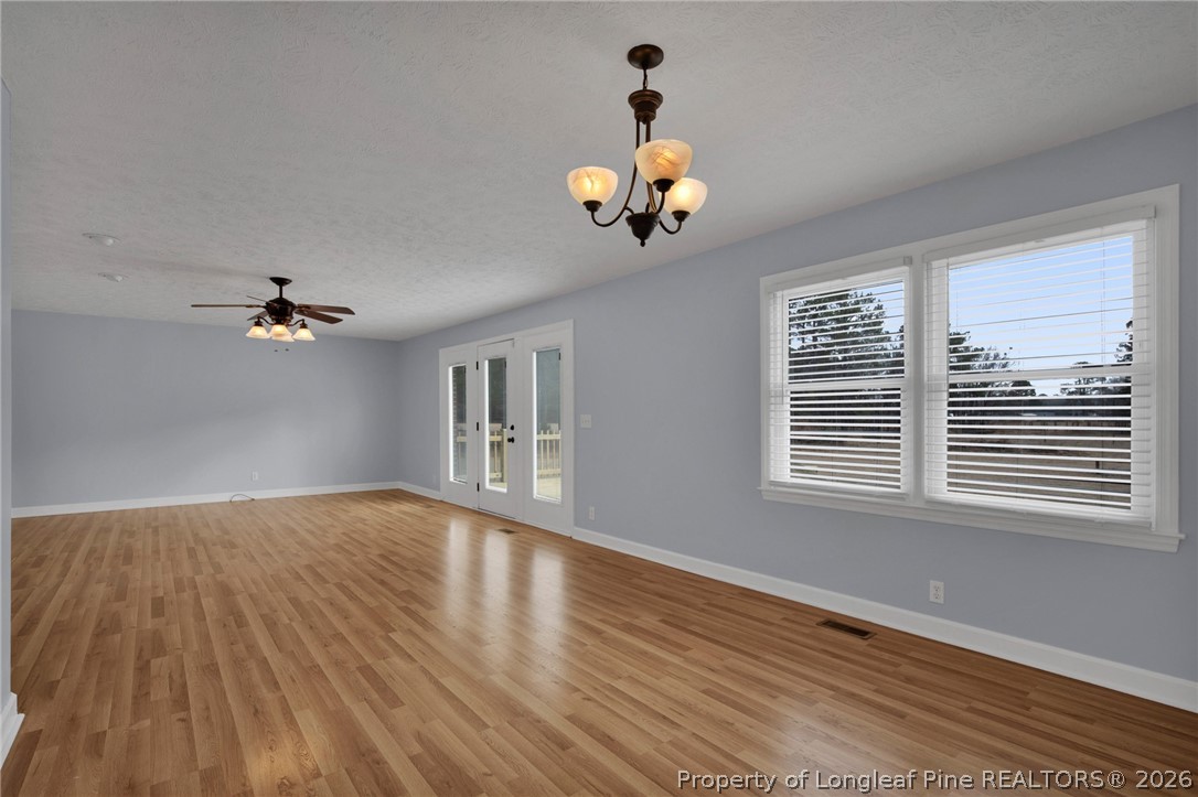 1064 Bainbridge Road Stedman, NC 28391 - Photo 17 of 46 a view of an room with wooden floor and a window