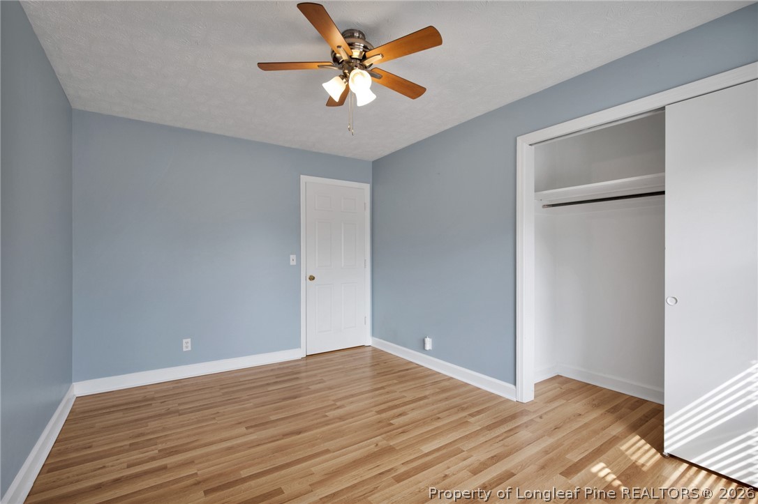 1064 Bainbridge Road Stedman, NC 28391 - Photo 23 of 46 a view of an empty room with wooden floor