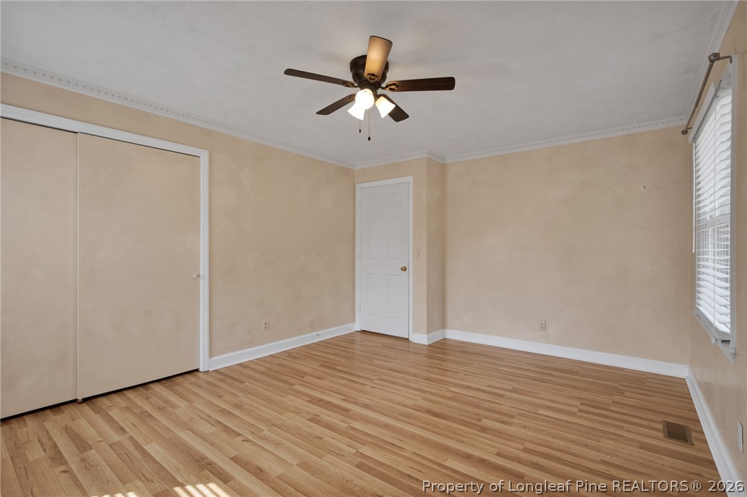 1064 Bainbridge Road Stedman, NC 28391 - Photo 26 of 46 wooden floor in an empty room with a window