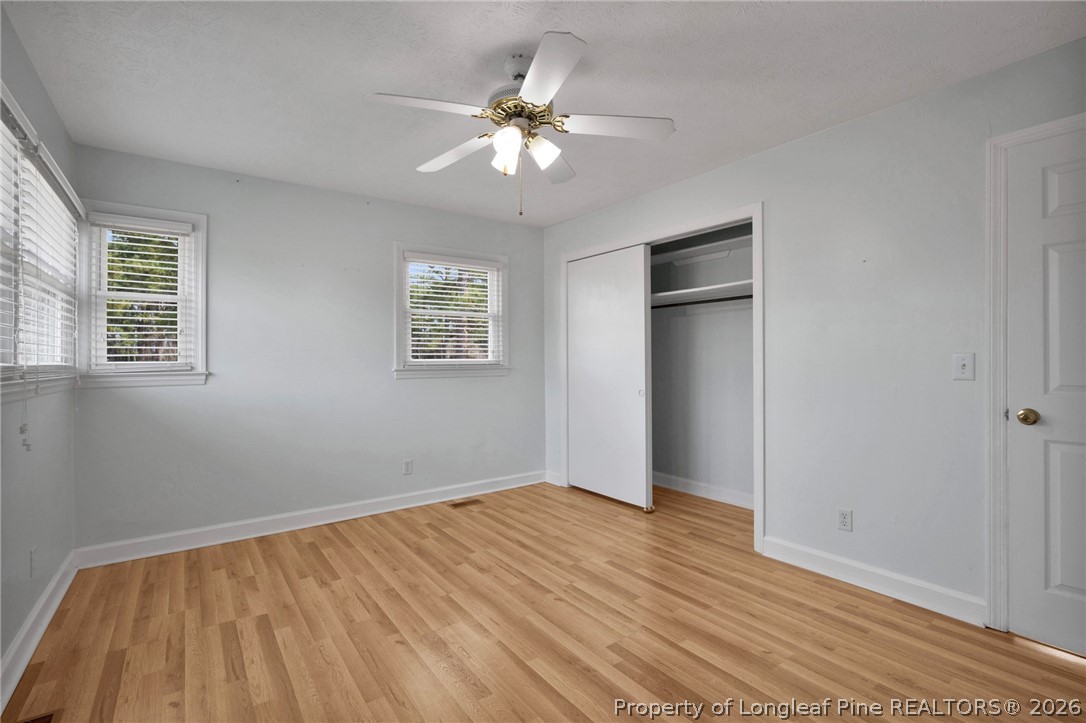 1064 Bainbridge Road Stedman, NC 28391 - Photo 28 of 46 a view of an empty room with wooden floor and a window