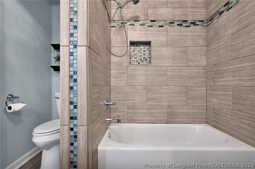 1064 Bainbridge Road Stedman, NC 28391 - Photo 30 of 46 a bathroom with a shower and a toilet