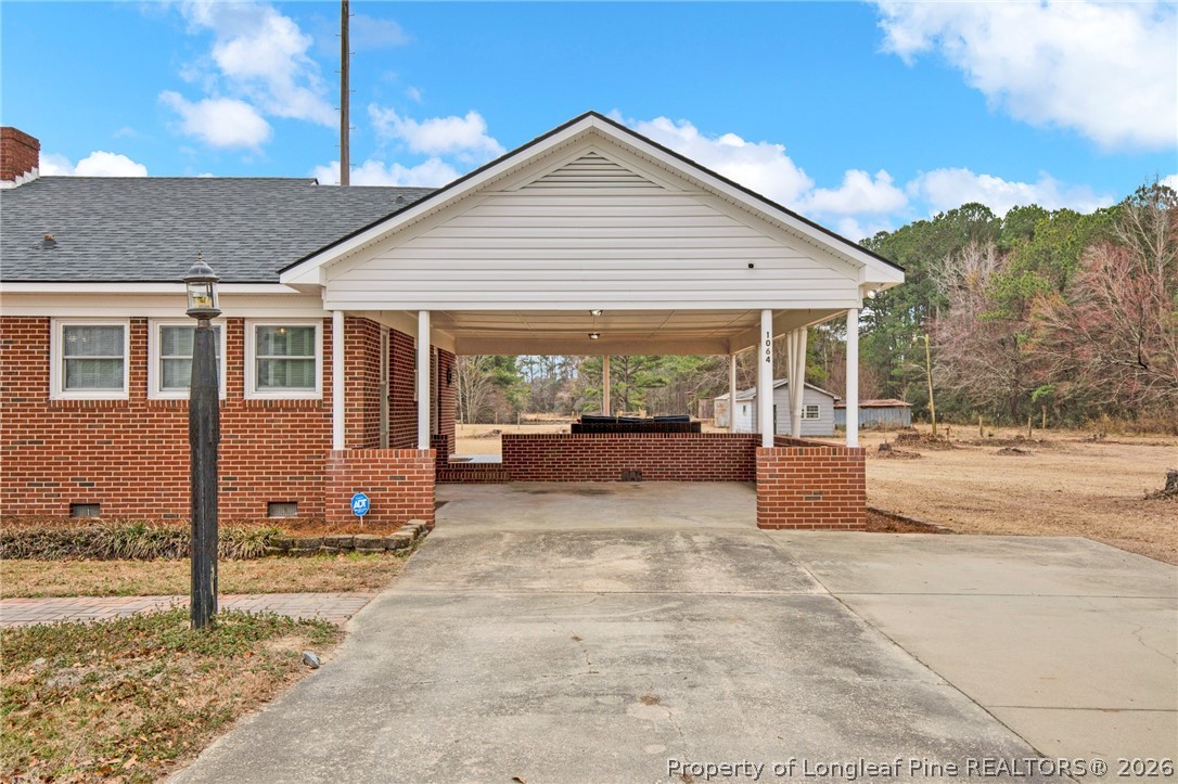1064 Bainbridge Road Stedman, NC 28391 - Photo 3 of 46 a view of a house with backyard and sitting area