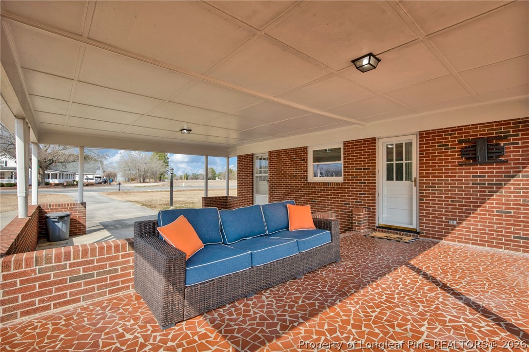 1064 Bainbridge Road Stedman, NC 28391 - Photo 34 of 46 a view of living room with patio furniture and wooden floor