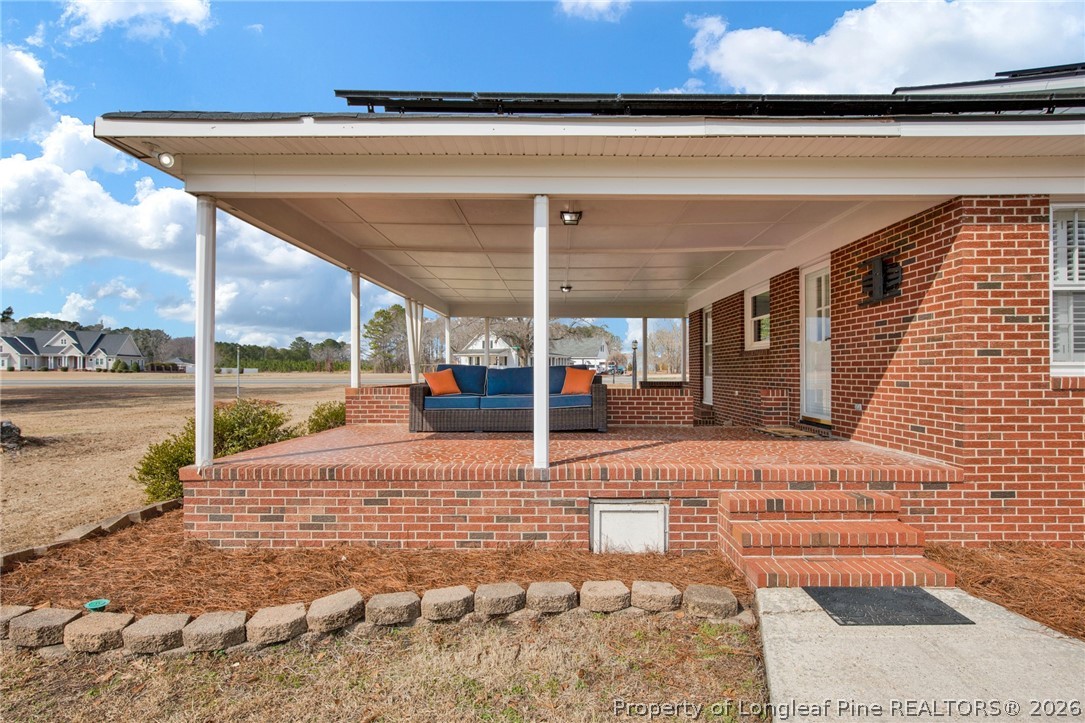 1064 Bainbridge Road Stedman, NC 28391 - Photo 35 of 46 a view of a patio with a table and chairs