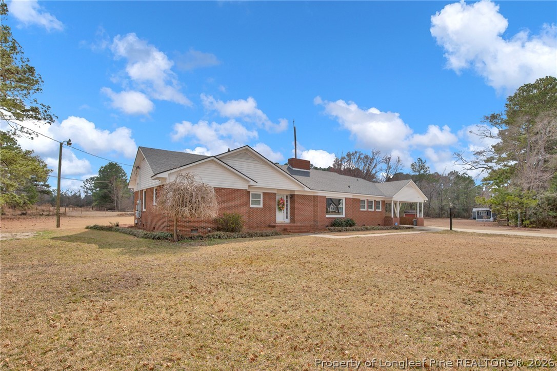 1064 Bainbridge Road Stedman, NC 28391 - Photo 4 of 46 a view of a house with a yard