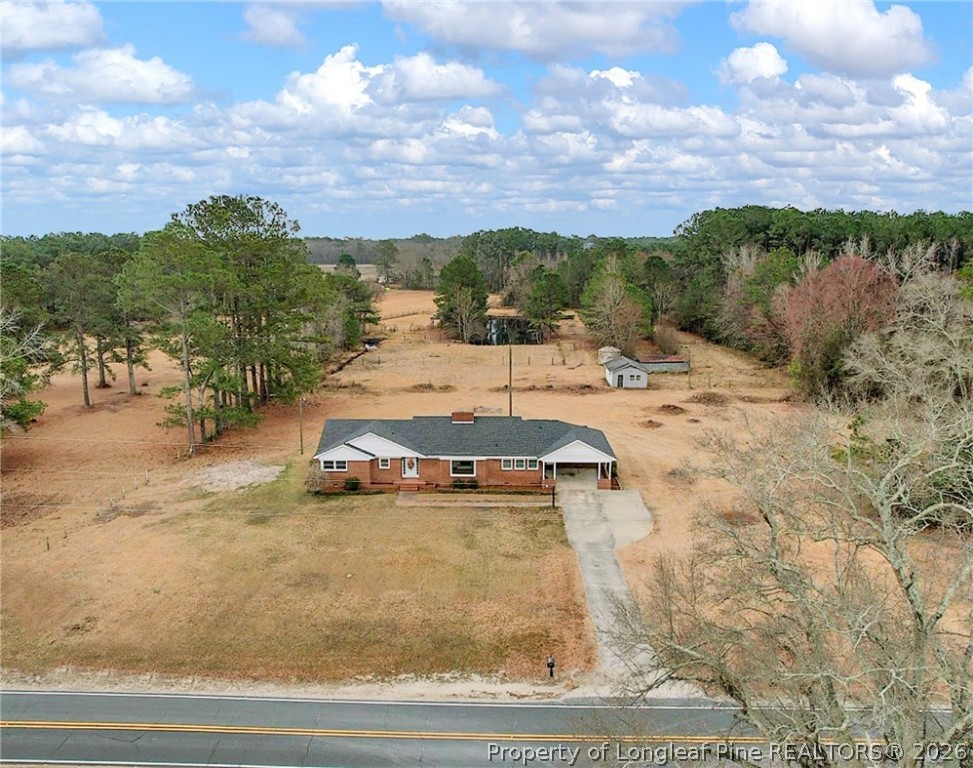 1064 Bainbridge Road Stedman, NC 28391 - Photo 42 of 46 a view of a yard with cars