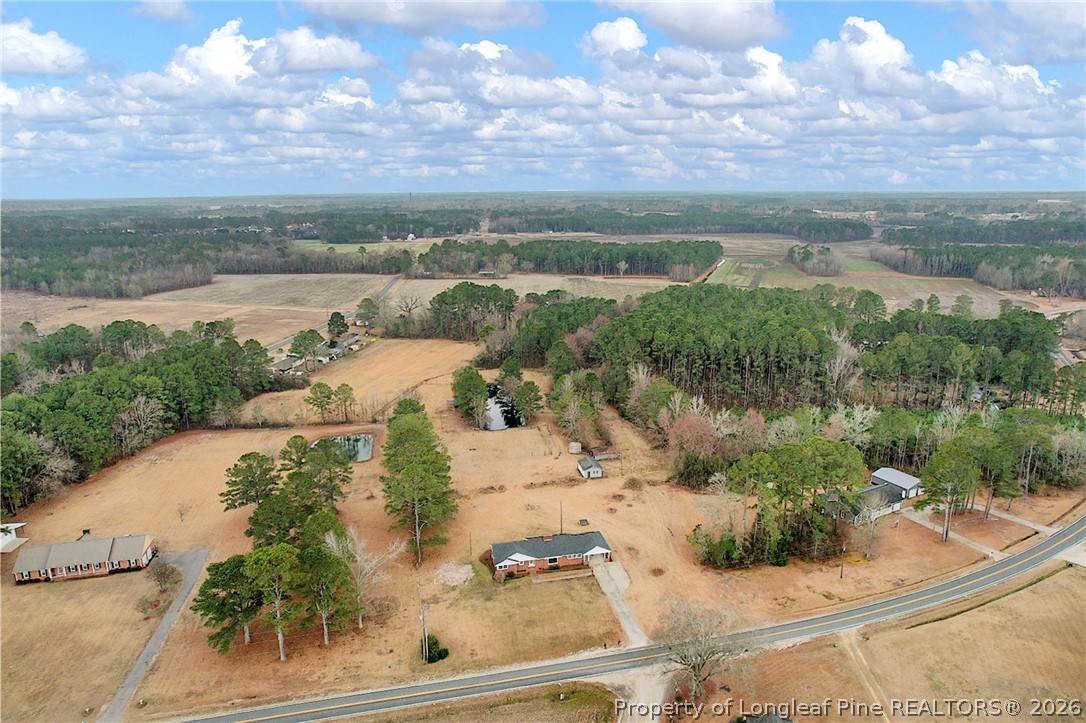 1064 Bainbridge Road Stedman, NC 28391 - Photo 43 of 46 a view of a lake with a yard