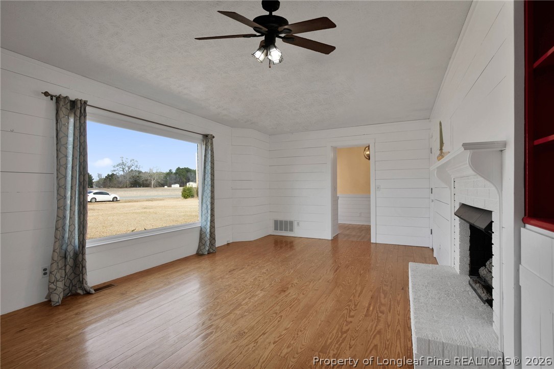 1064 Bainbridge Road Stedman, NC 28391 - Photo 8 of 46 a view of a livingroom with a fireplace and window