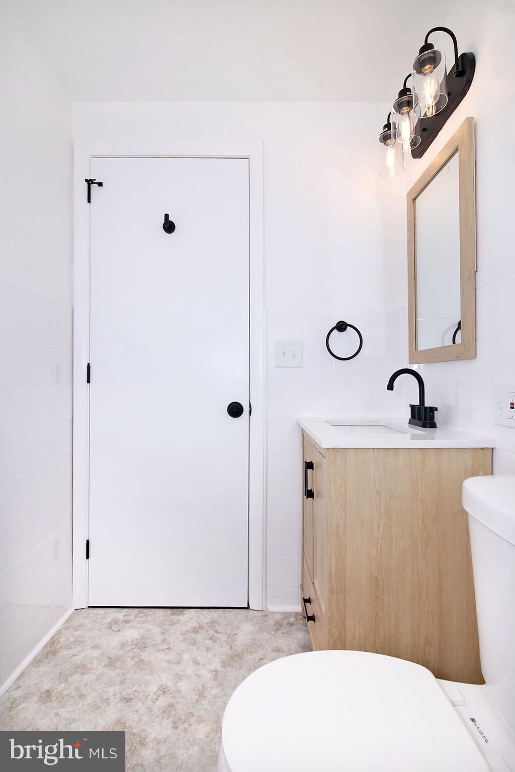 1011 State Drive Lebanon, PA 17042 - Photo 15 of 34 a bathroom with a sink and a mirror
