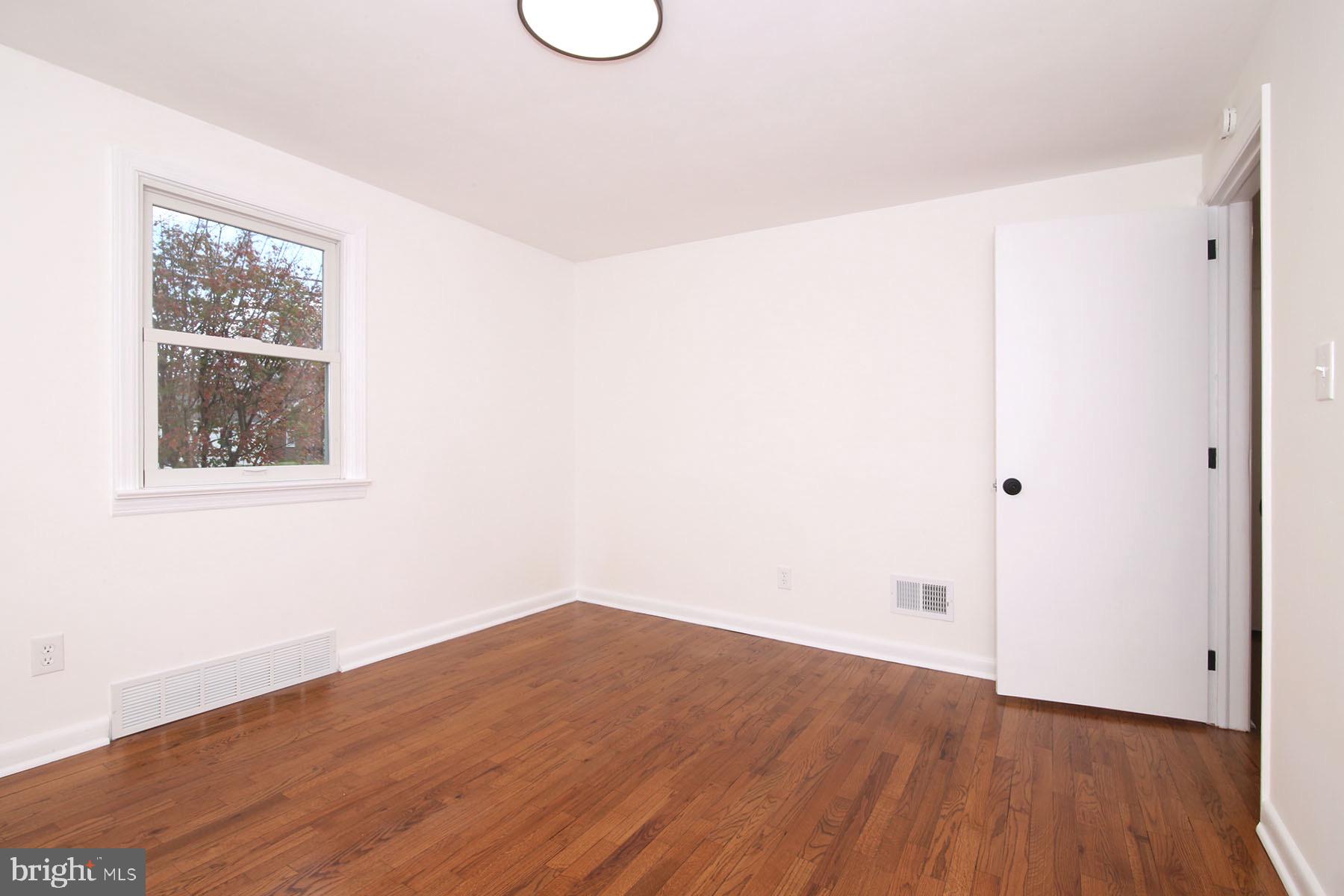 1011 State Drive Lebanon, PA 17042 - Photo 19 of 34 a view of a room with wooden floor and white walls