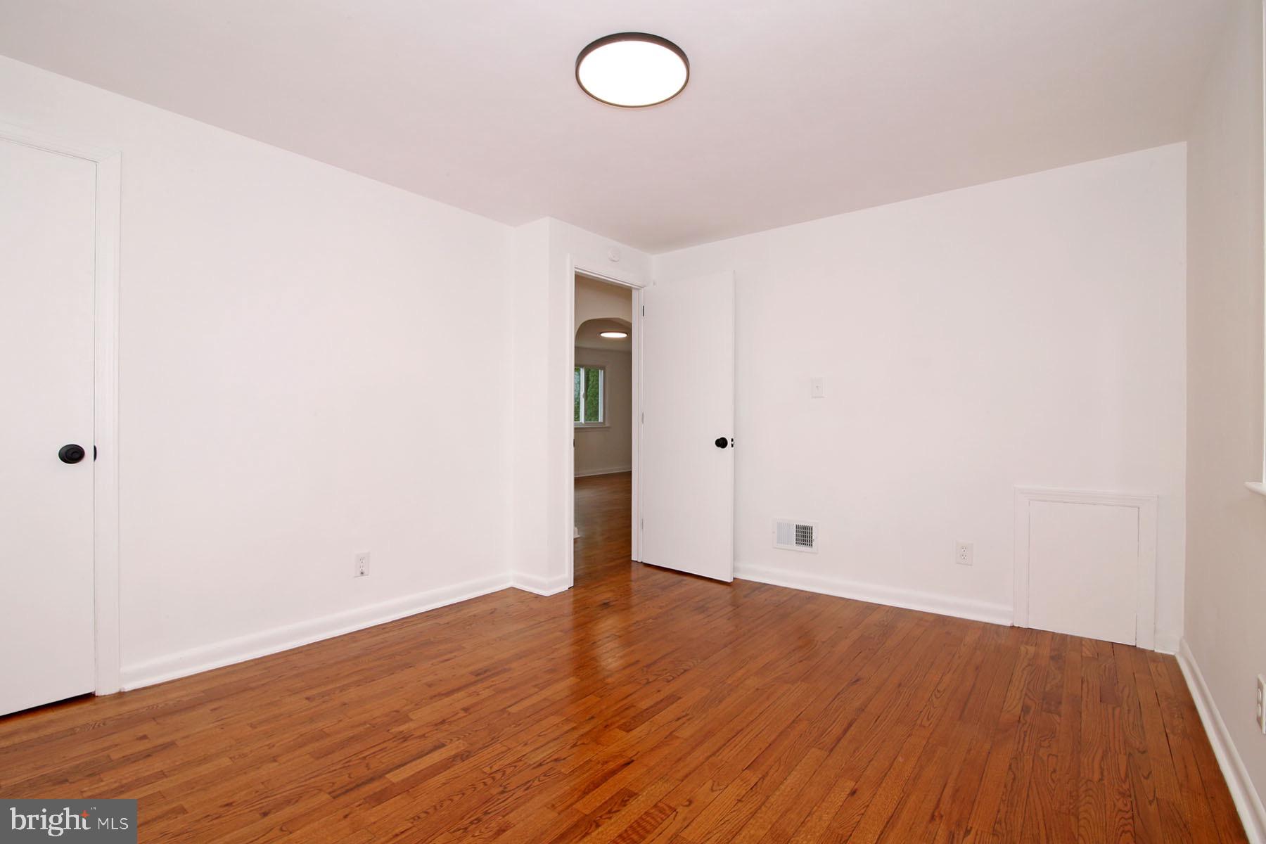 1011 State Drive Lebanon, PA 17042 - Photo 21 of 34 an empty room with wooden floor and windows