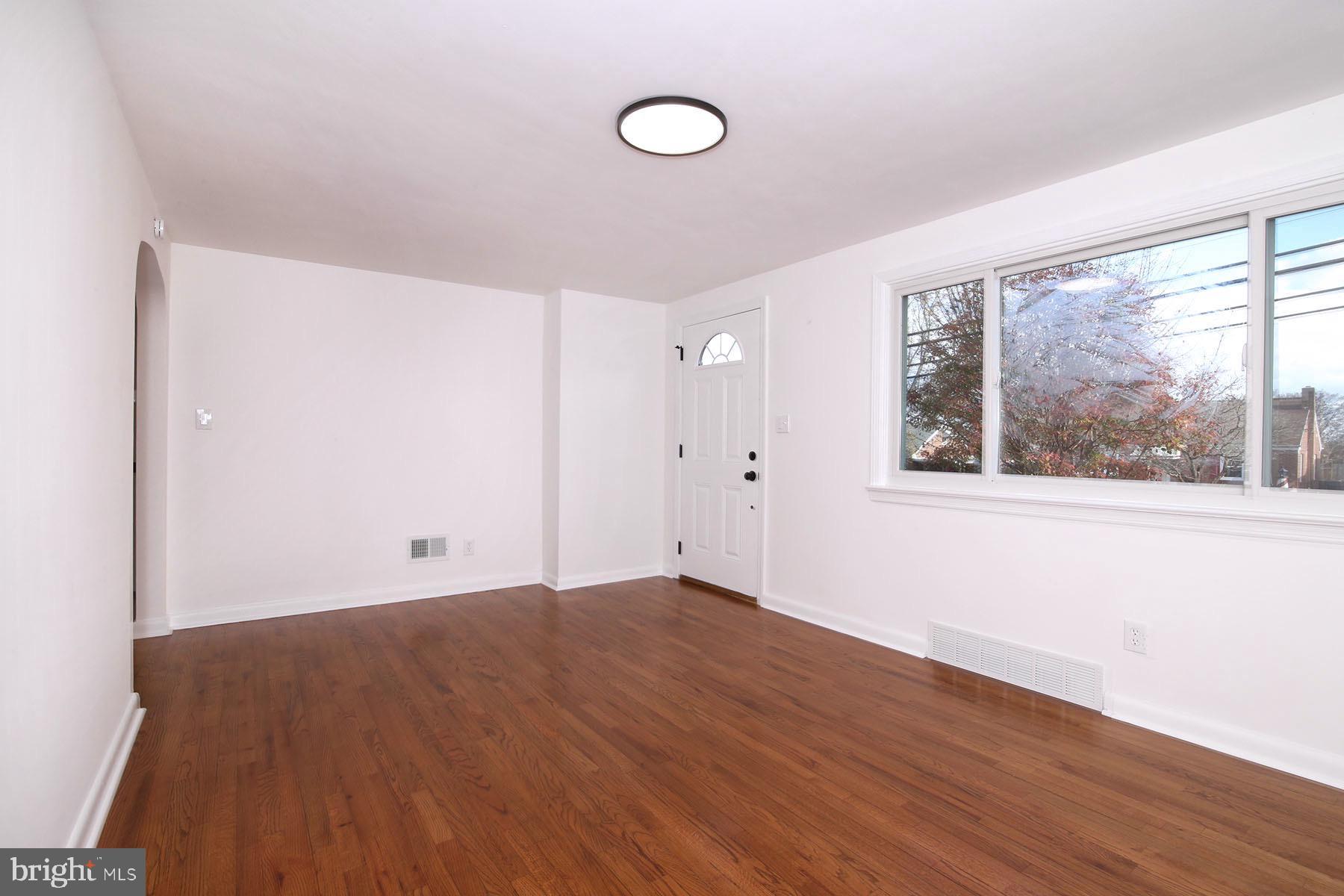 1011 State Drive Lebanon, PA 17042 - Photo 26 of 34 an empty room with wooden floor and windows