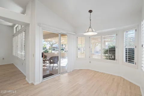 a bathroom with a sink a mirror a toilet and shower