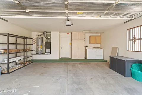 a view of a patio with table and chairs and wooden floor