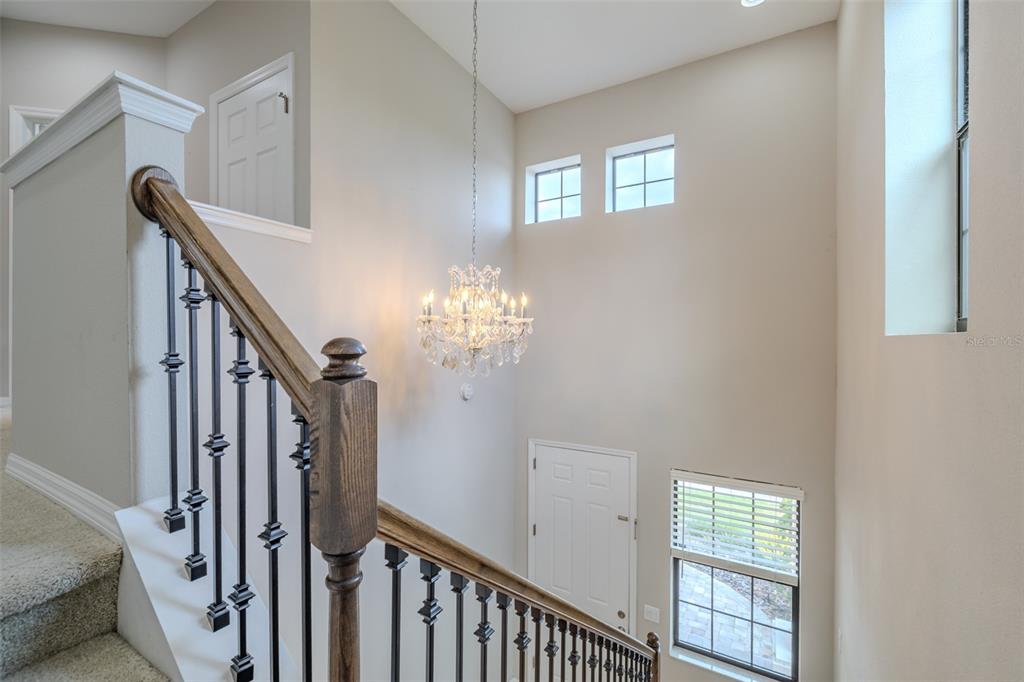 4730 Wandering Way Wesley Chapel, FL 33544 - Photo 23 of 61 a view of a hallway with windows