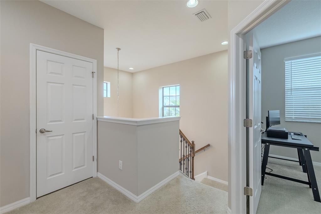 4730 Wandering Way Wesley Chapel, FL 33544 - Photo 37 of 61 a view of a hallway with closet and a window