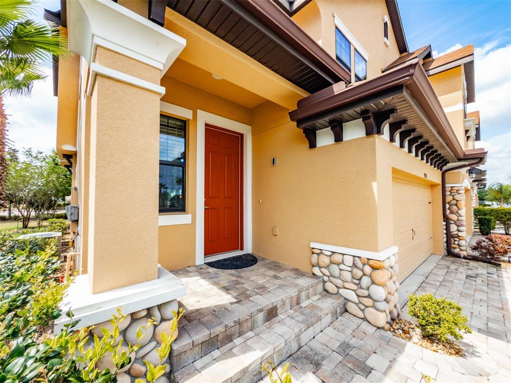 4730 Wandering Way Wesley Chapel, FL 33544 - Photo 4 of 61 a front view of a house with a yard