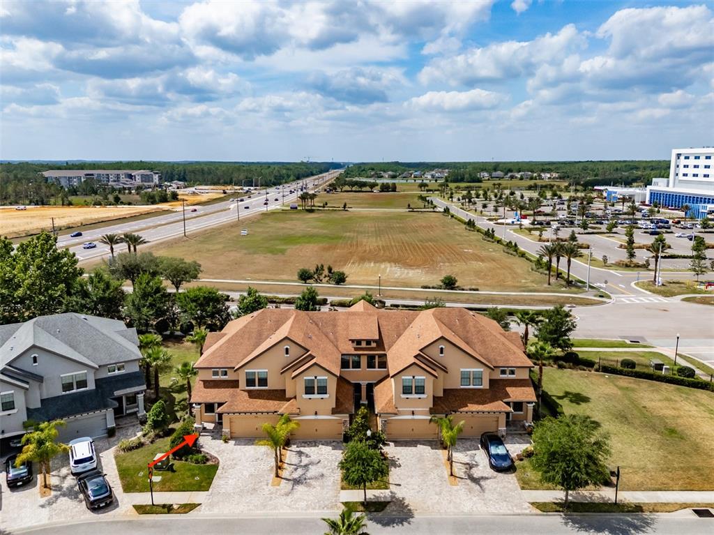4730 Wandering Way Wesley Chapel, FL 33544 - Photo 41 of 61 an aerial view of a house with a lake view